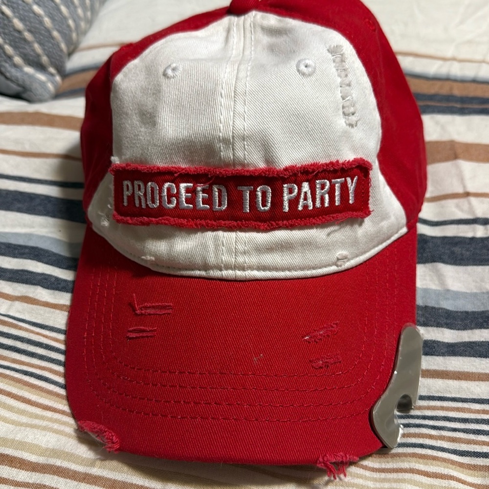 Toby Keith’s I Love This Bar “Proceed to Party” cap with built-in bottle opener